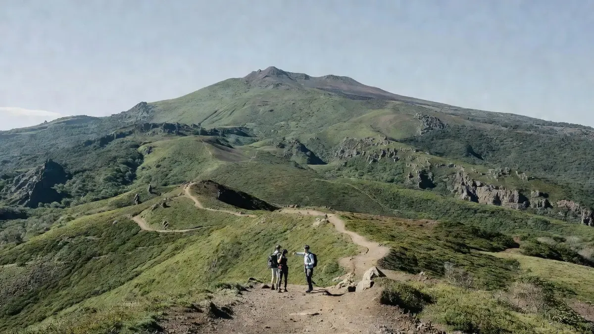 The broad volcanic slopes of Mount Hallasan under a clear autumn sky on a tour of Jeju Island Korea, South Korea